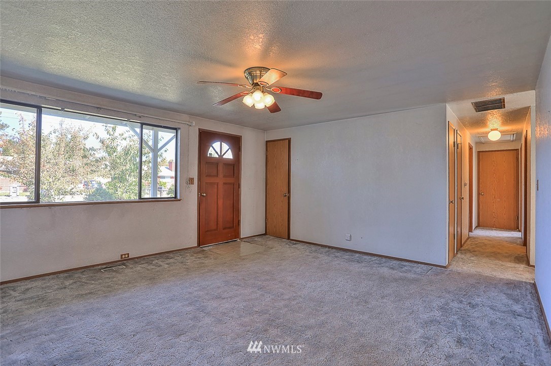 3601 Northeast 10th Street Renton, WA 98056 - Photo 6 of 25 wooden floor in an empty room with a window