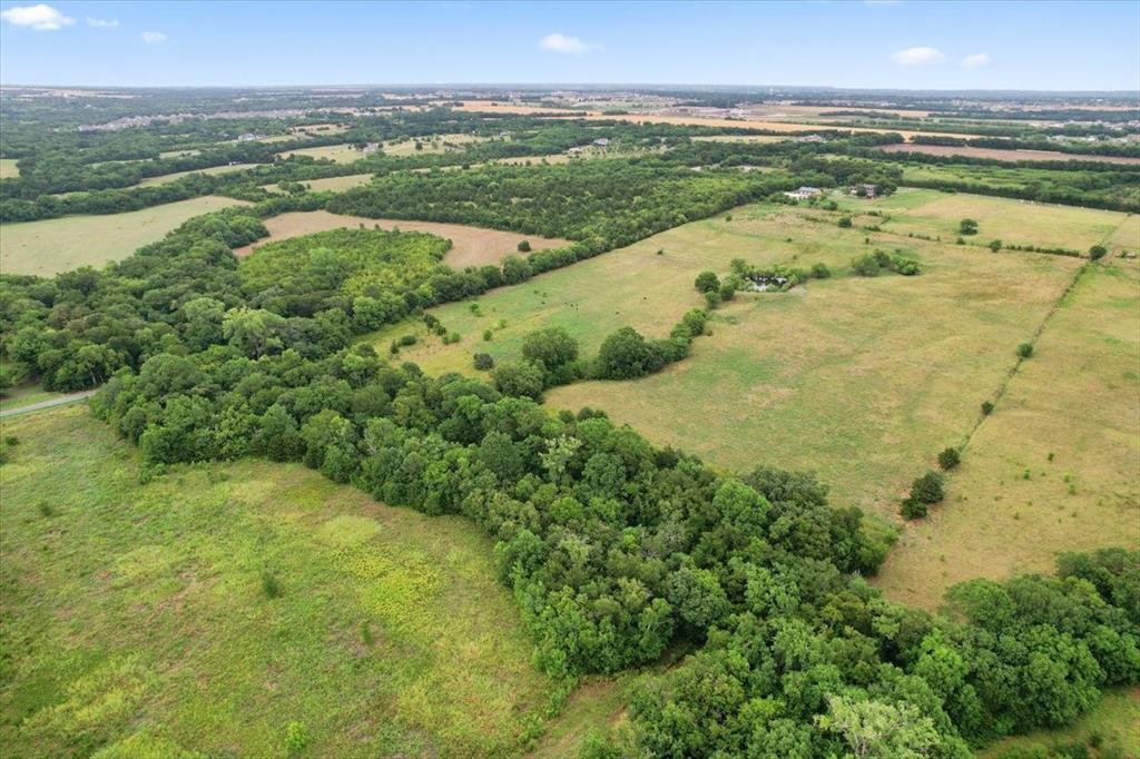 0 Whitaker Road Van Alstyne, TX 75495 - Photo 4 of 7 a view of a lake with a city