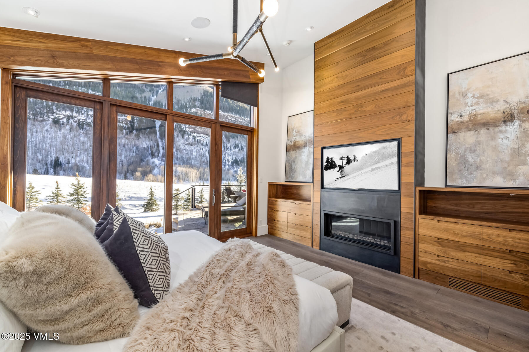 2470 Bald Mountain Road Vail, CO 81657 - Photo 13 of 29 a spacious bedroom with a bed and wooden floor