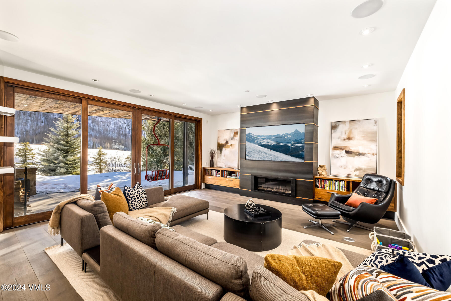 2470 Bald Mountain Road Vail, CO 81657 - Photo 19 of 29 a living room with furniture large window and a flat screen tv