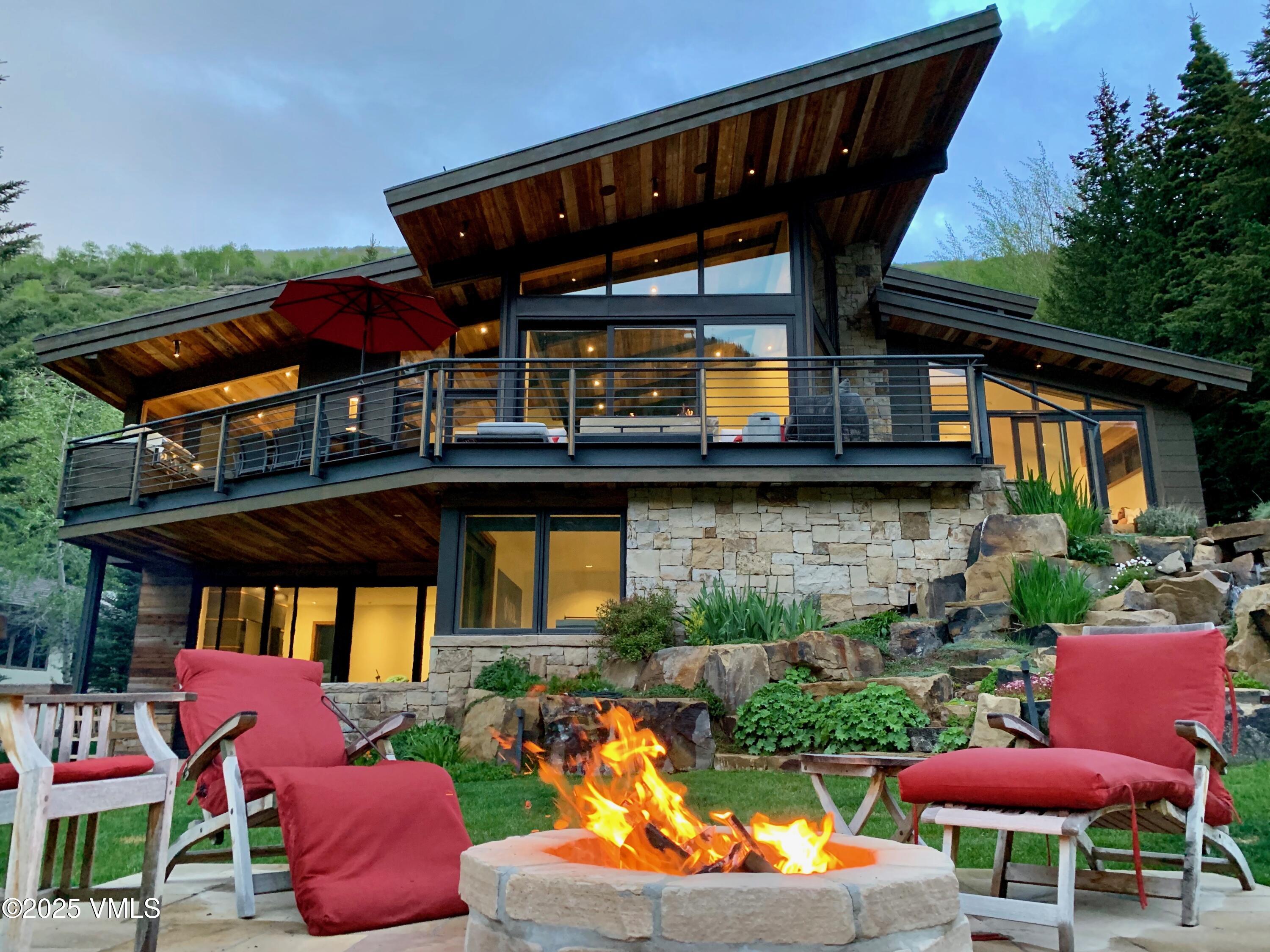 2470 Bald Mountain Road Vail, CO 81657 - Photo 25 of 29 a view of a chairs and table in the patio