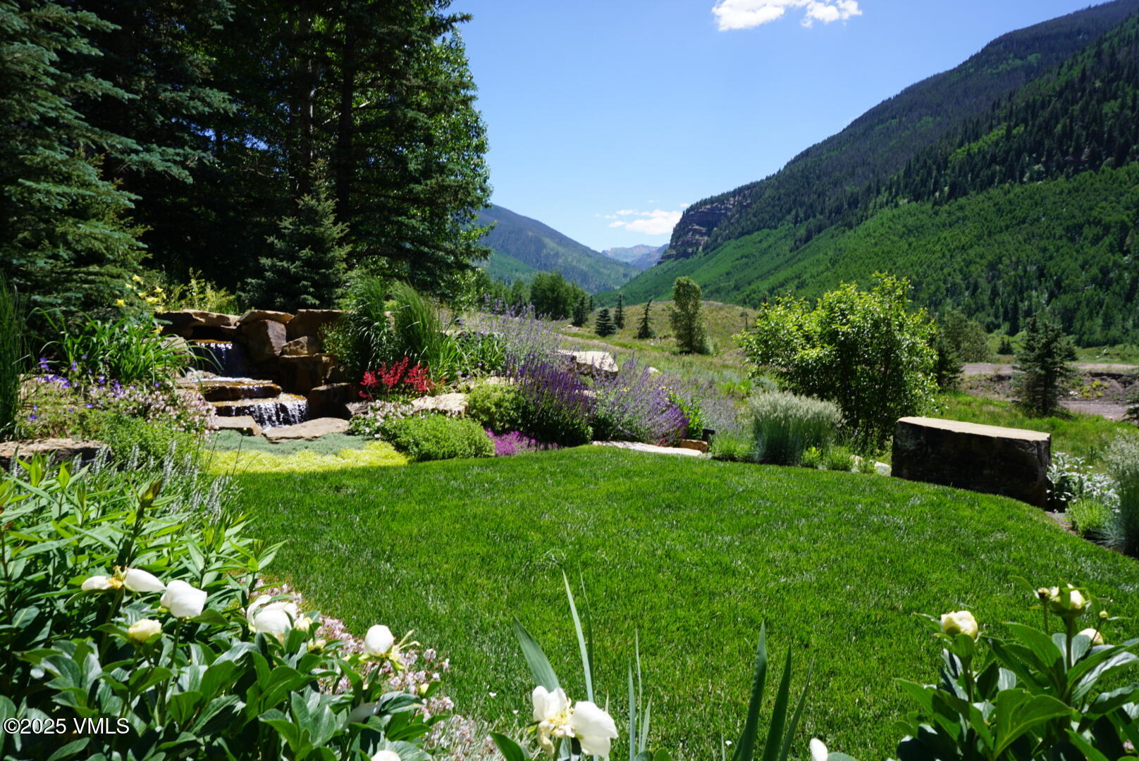2470 Bald Mountain Road Vail, CO 81657 - Photo 26 of 29 a view of a backyard with sitting area