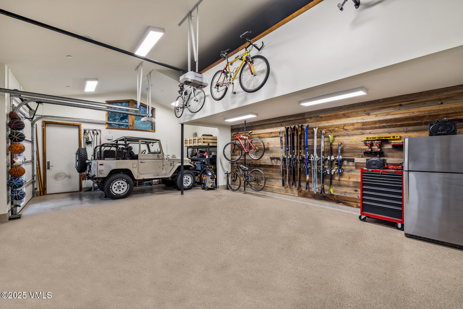 2470 Bald Mountain Road Vail, CO 81657 - Photo 29 of 29 a view of parking garage with cars and a ceiling fan