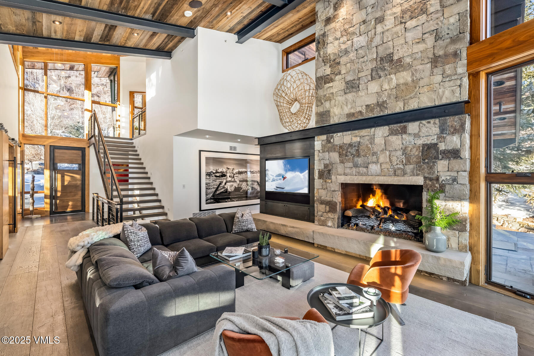 2470 Bald Mountain Road Vail, CO 81657 - Photo 8 of 29 a outdoor living space with patio furniture and a fireplace