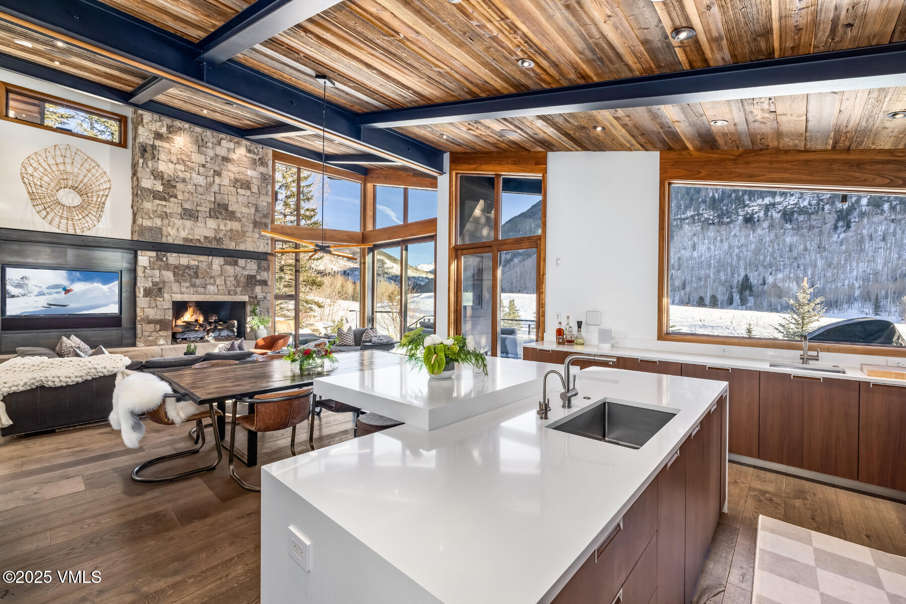 2470 Bald Mountain Road Vail, CO 81657 - Photo 10 of 29 a kitchen with a table chairs and a wooden floor