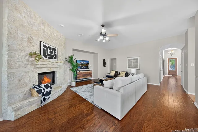 a living room with furniture and a fireplace
