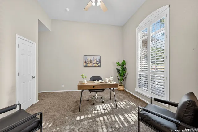 a workspace with furniture and a window