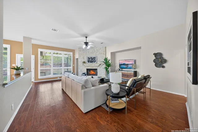 a living room with furniture and a fireplace