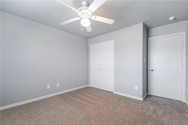 a bathroom with a bathtub shower sink vanity mirror and toilet