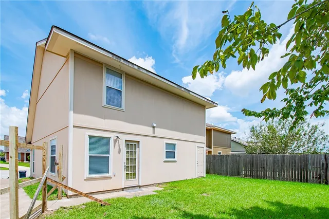 a backyard of a house with lots of green space