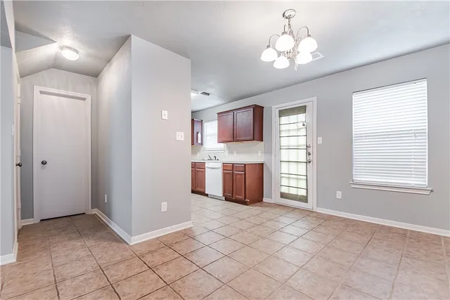 a view of a kitchen with a sink and dishwasher cabinets
