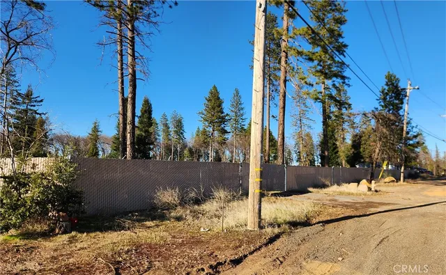 a view of a backyard of the house