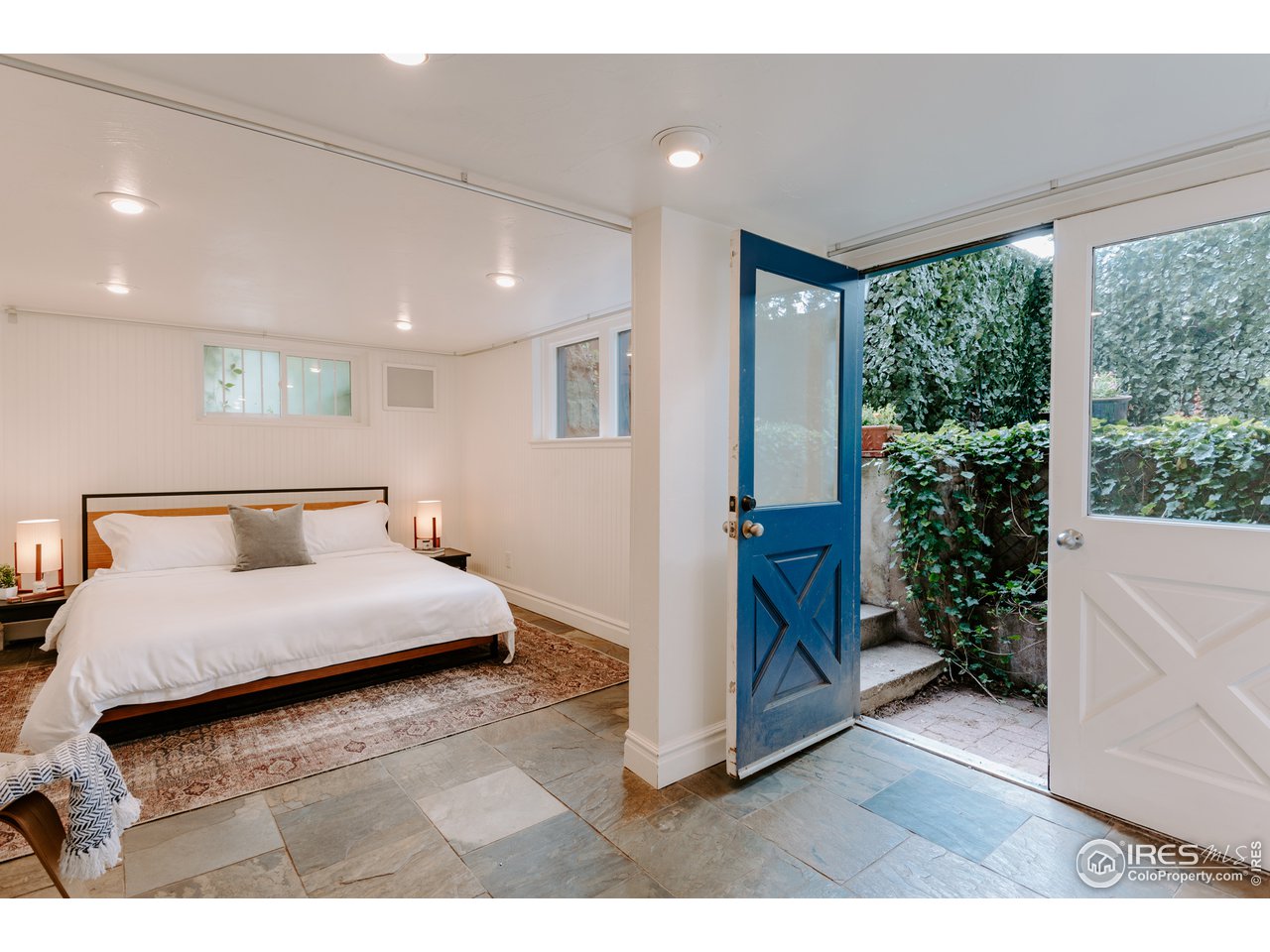 1188 Forest Avenue Boulder, CO 80304 - Photo 16 of 38 Lower level primary bedroom walks out to private patio and garden area