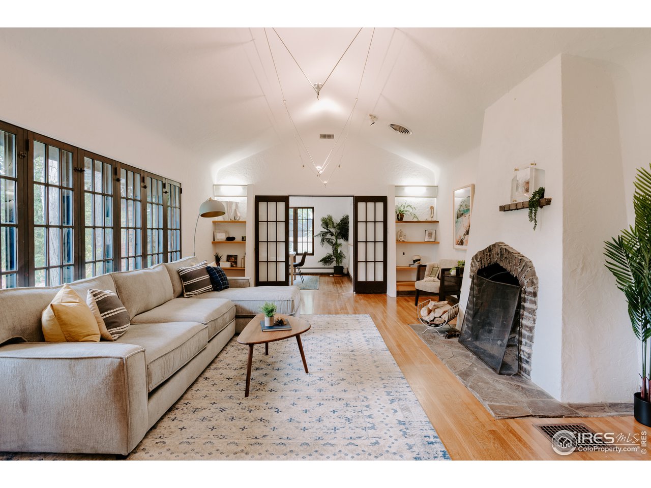 1188 Forest Avenue Boulder, CO 80304 - Photo 4 of 38 Enter directly into the heart of the home: the high-ceilinged living room with fireplace