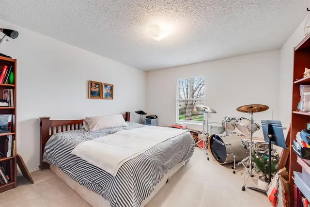 a bedroom with a bed and a couch