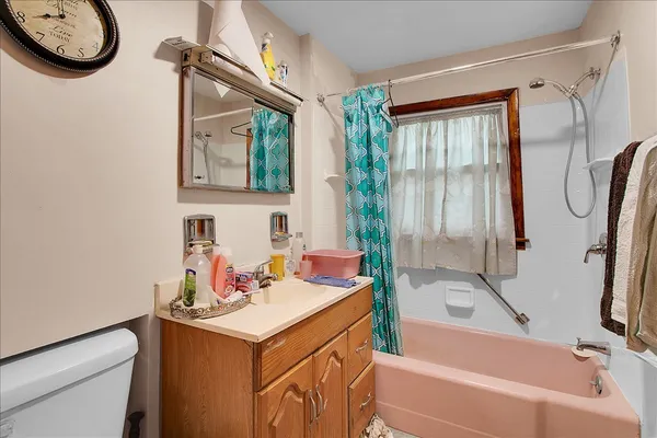 a bathroom with a sink a toilet and a bathtub