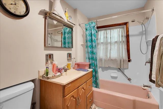 a bathroom with a sink a toilet and a bathtub