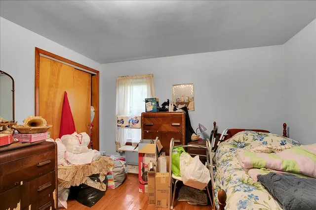 a bed room with a bed and a window