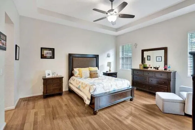 a bedroom with a bed and a dresser