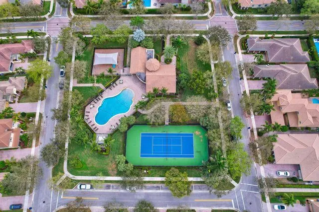 an aerial view of a house with yard swimming pool and outdoor seating