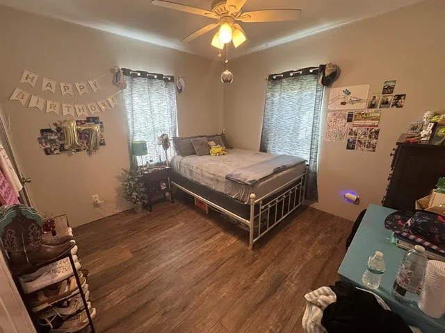 a bed room with a bed and a chandelier