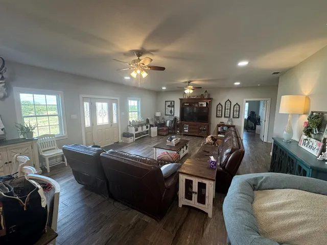 a living room with furniture and a flat screen tv