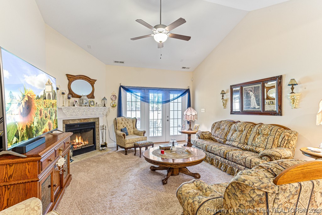 4532 Niagara Carthage Road Carthage, NC 28327 - Photo 14 of 44 a living room with furniture and a fireplace