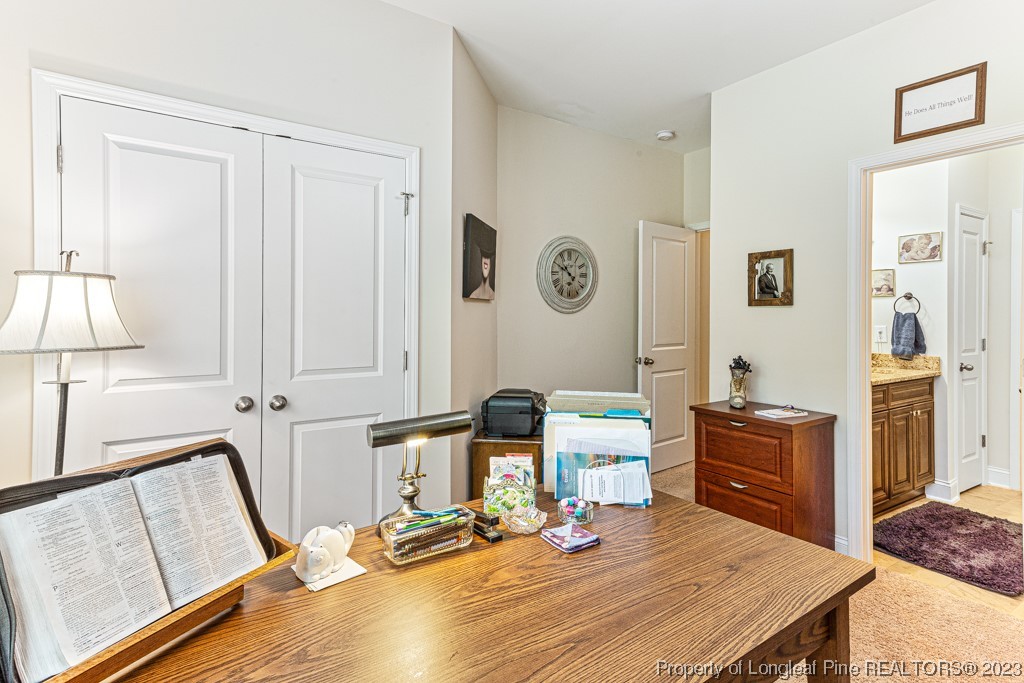 4532 Niagara Carthage Road Carthage, NC 28327 - Photo 22 of 44 a room with a table chairs and a refrigerator
