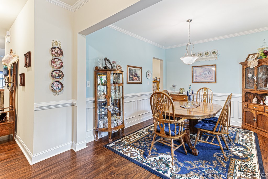 4532 Niagara Carthage Road Carthage, NC 28327 - Photo 7 of 44 a view of a dining room with furniture and wooden floor