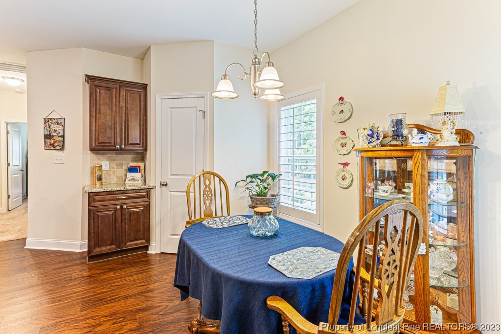4532 Niagara Carthage Road Carthage, NC 28327 - Photo 9 of 44 a view of a dining room with furniture and wooden floor