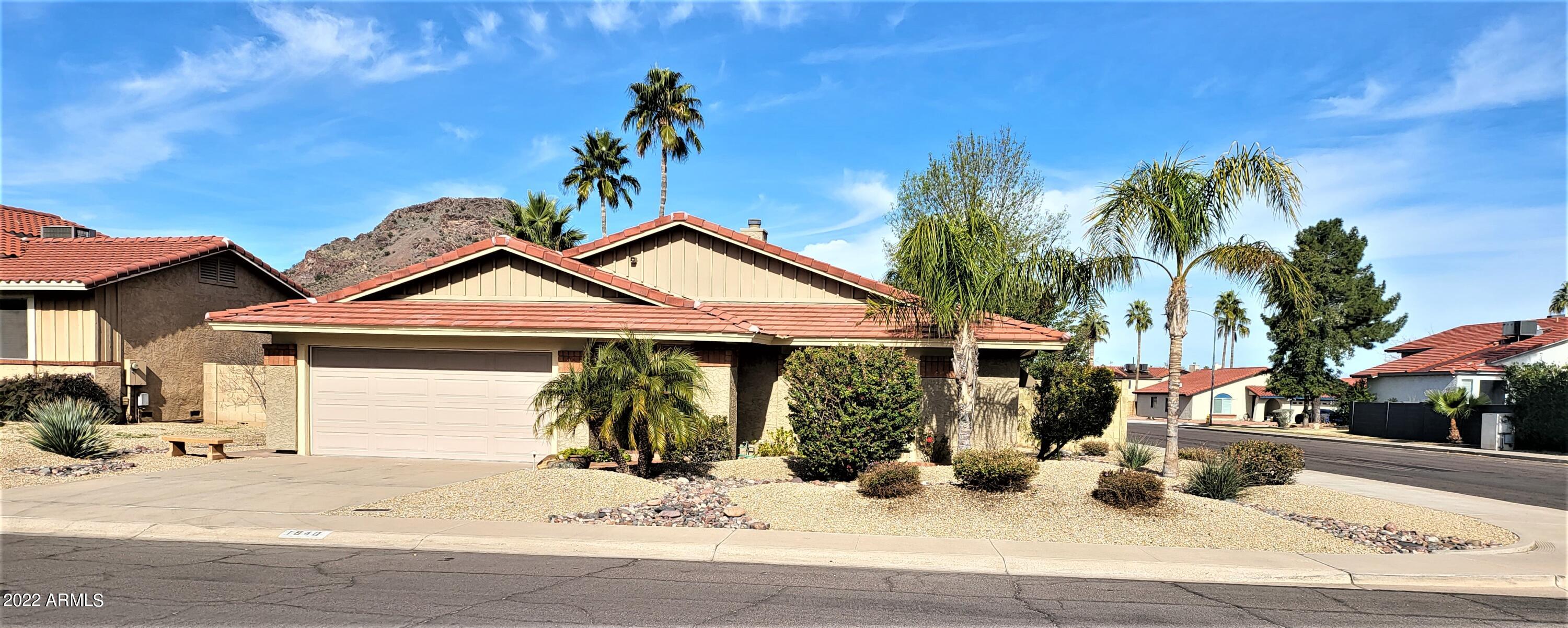 1940 East Hearn Road Phoenix, AZ 85022 - Photo 1 of 51 a front view of a house with garden