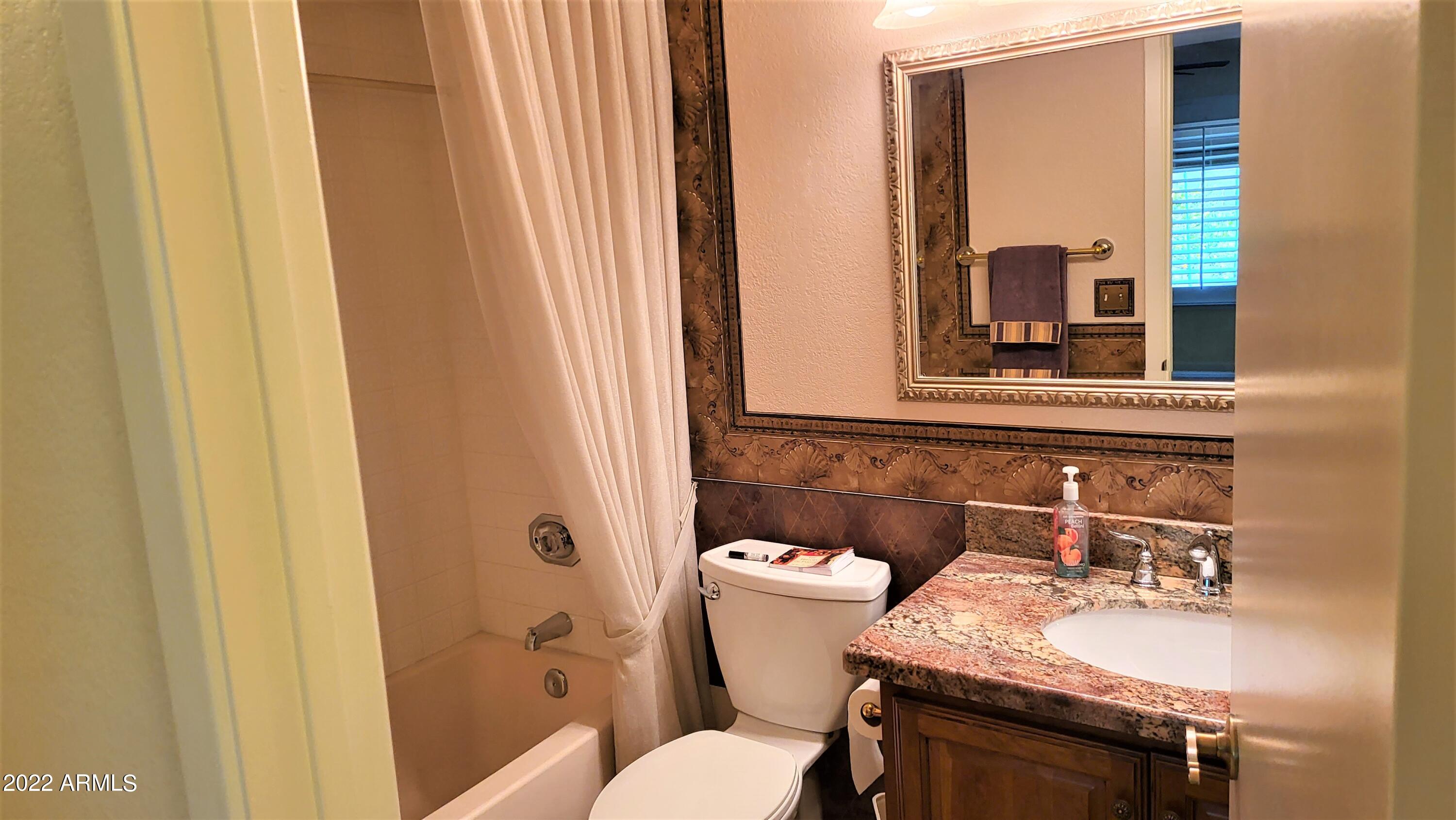 1940 East Hearn Road Phoenix, AZ 85022 - Photo 24 of 51 a bathroom with a sink and a mirror