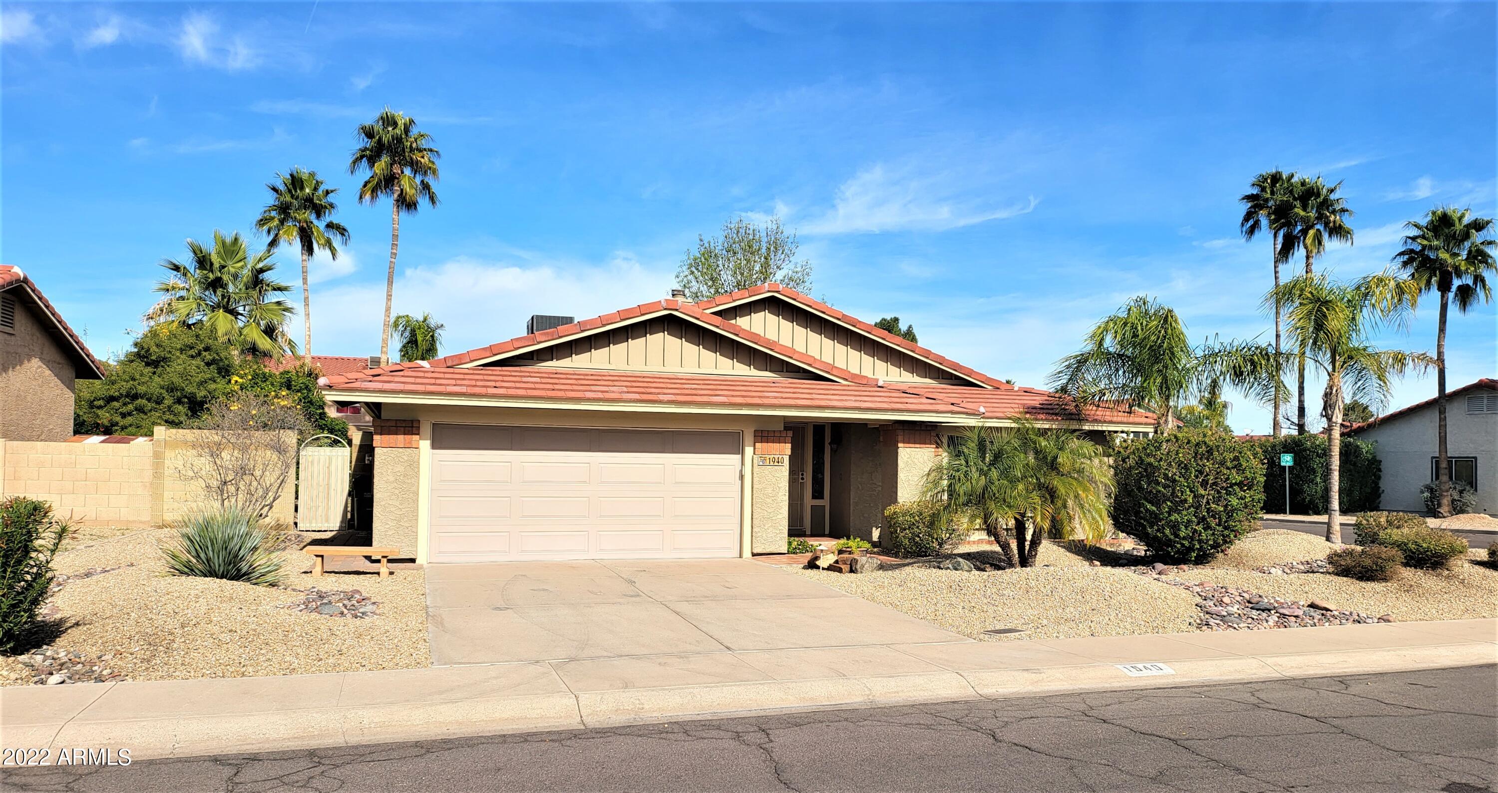 1940 East Hearn Road Phoenix, AZ 85022 - Photo 3 of 51 a front view of a house with a yard