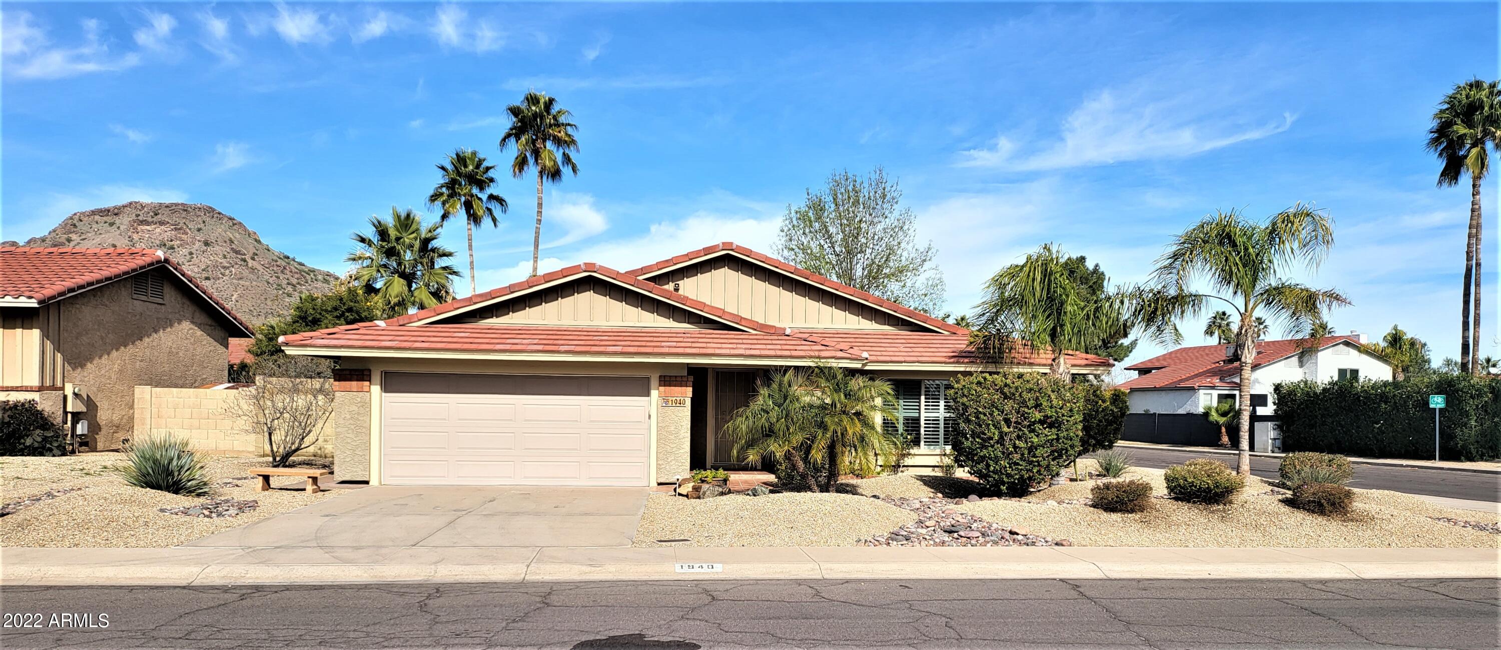 1940 East Hearn Road Phoenix, AZ 85022 - Photo 50 of 51 a view of a house with a patio