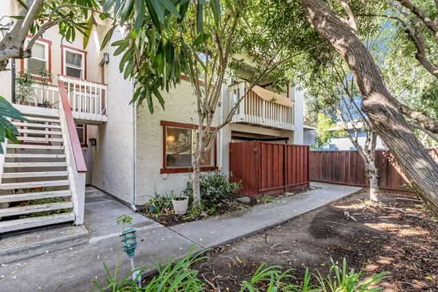 a kitchen with sink and cabinets