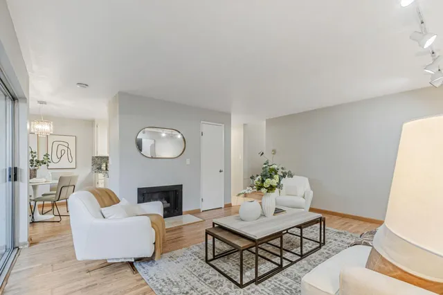 a spacious bedroom with a bed and a cabinets