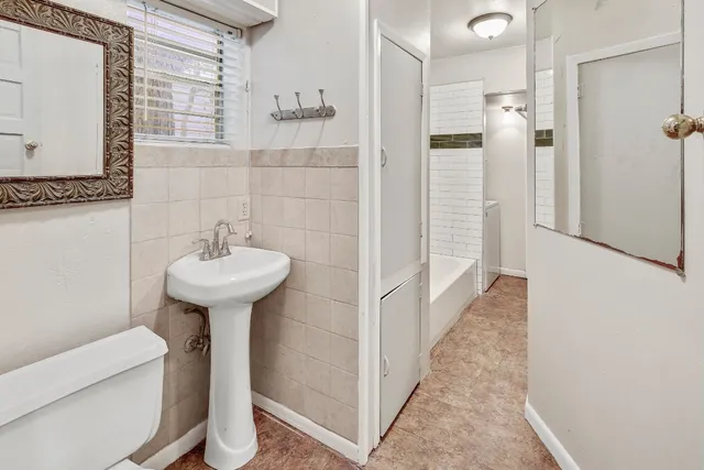 a bathroom with a sink and mirror