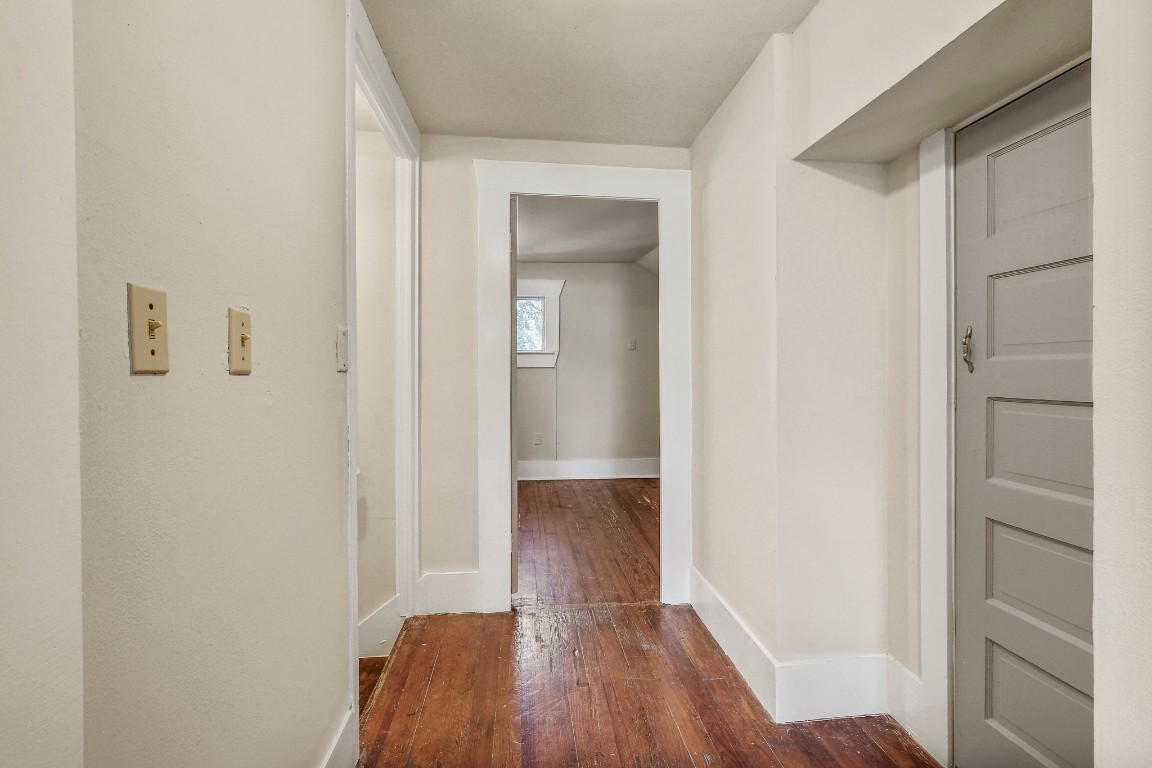 704 Franklin Boulevard, Unit A Austin, TX 78751 - Photo 22 of 32 a view of a hallway with wooden floor