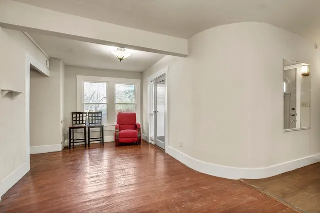 a view of livingroom with furniture wooden floor and windows