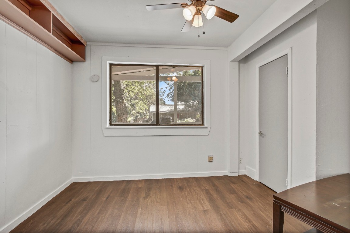 704 Franklin Boulevard, Unit A Austin, TX 78751 - Photo 10 of 32 wooden floor in an empty room with a window