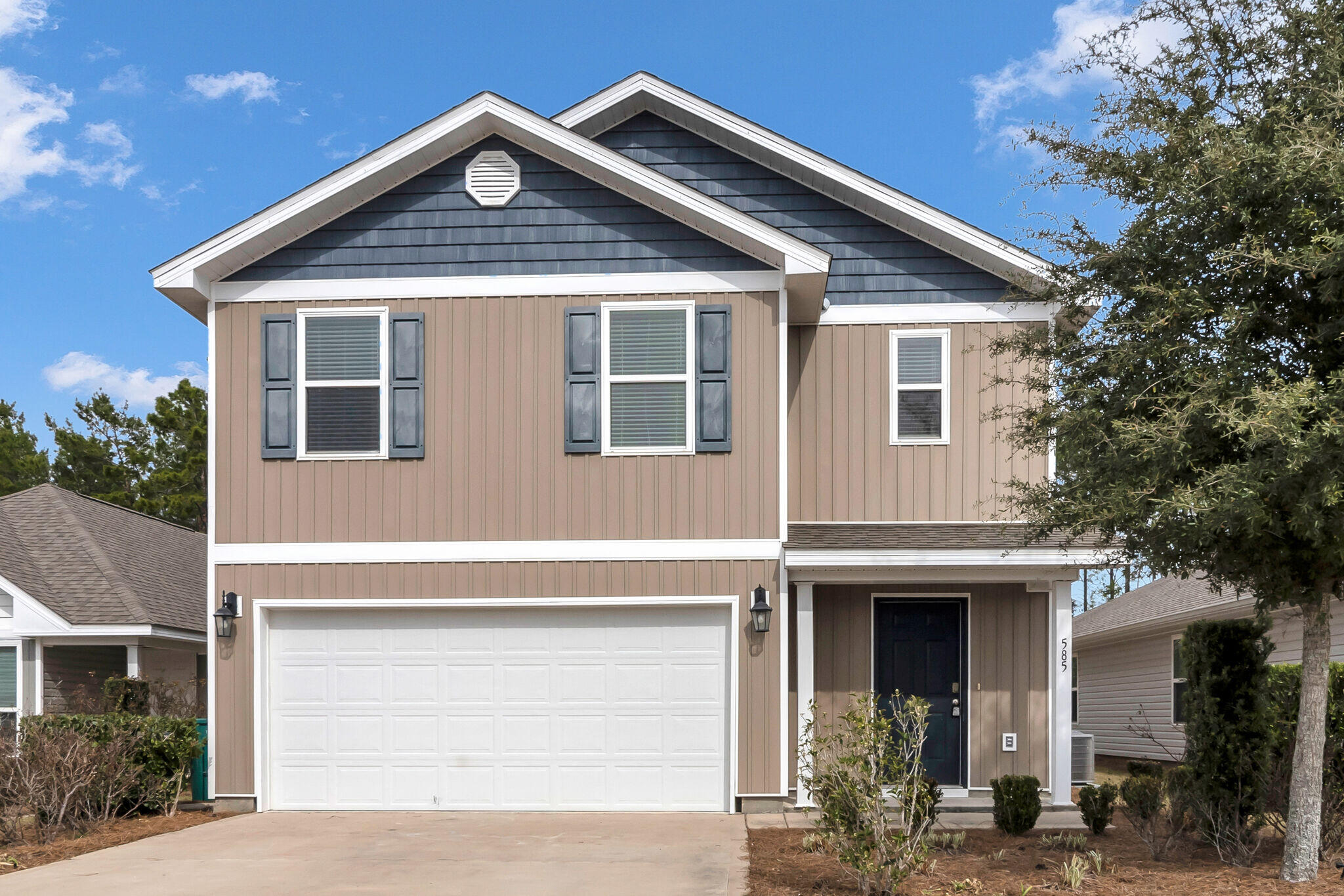 a front view of a house with yard