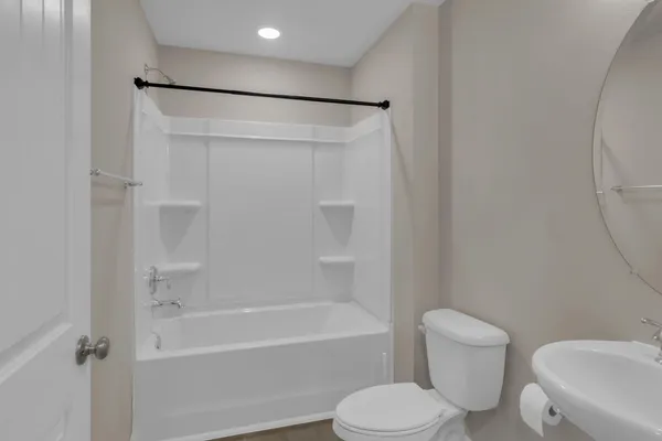 a bathroom with a toilet and a bathtub