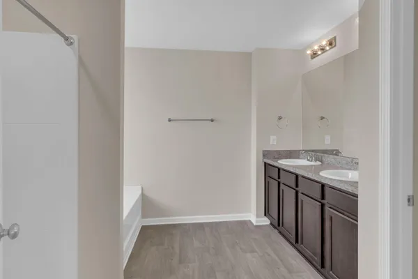 a view of a kitchen from a hallway