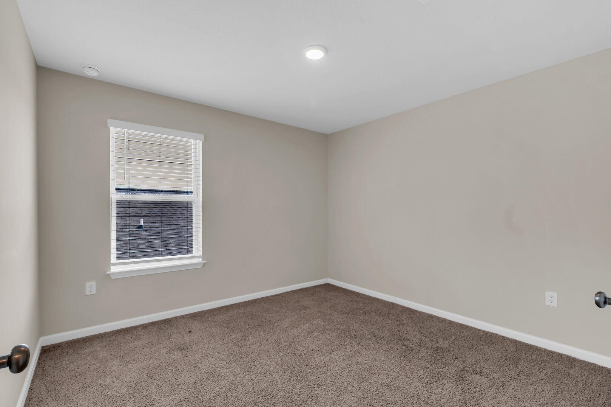 585 Earl Godwin Road Freeport, FL 32439 - Photo 30 of 46 an empty room with a window