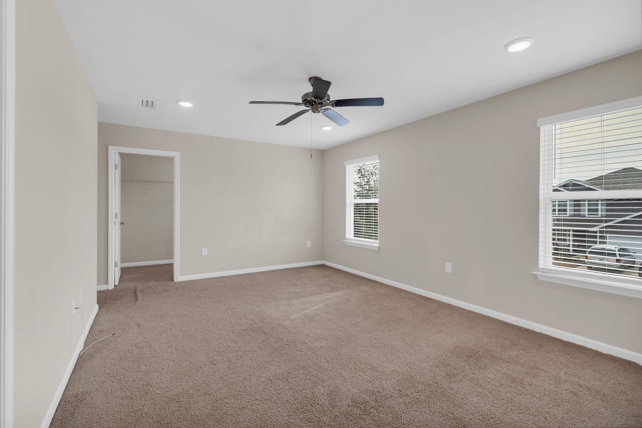 585 Earl Godwin Road Freeport, FL 32439 - Photo 32 of 46 an empty room with windows and fan