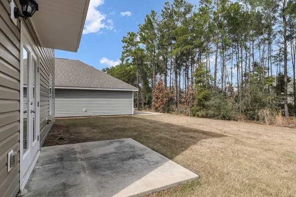 a view of a backyard of the house