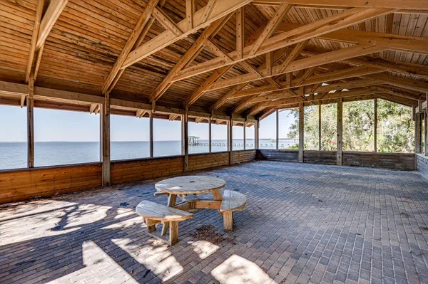 a view of a pathway of a house with wooden stairs
