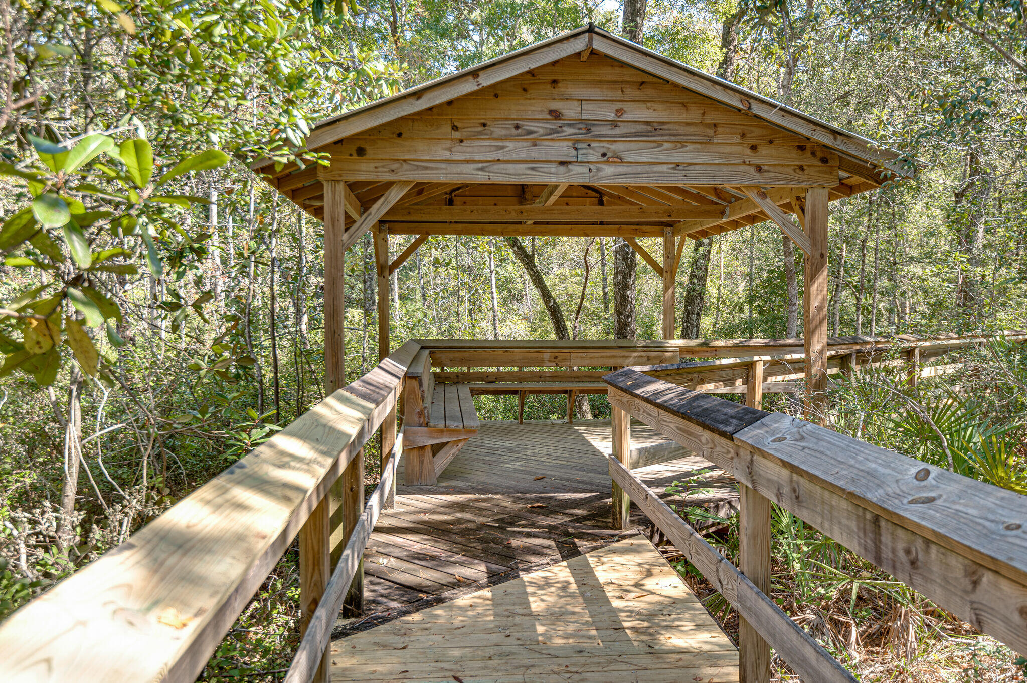 585 Earl Godwin Road Freeport, FL 32439 - Photo 44 of 46 a view of a roof deck with wooden floor and fence