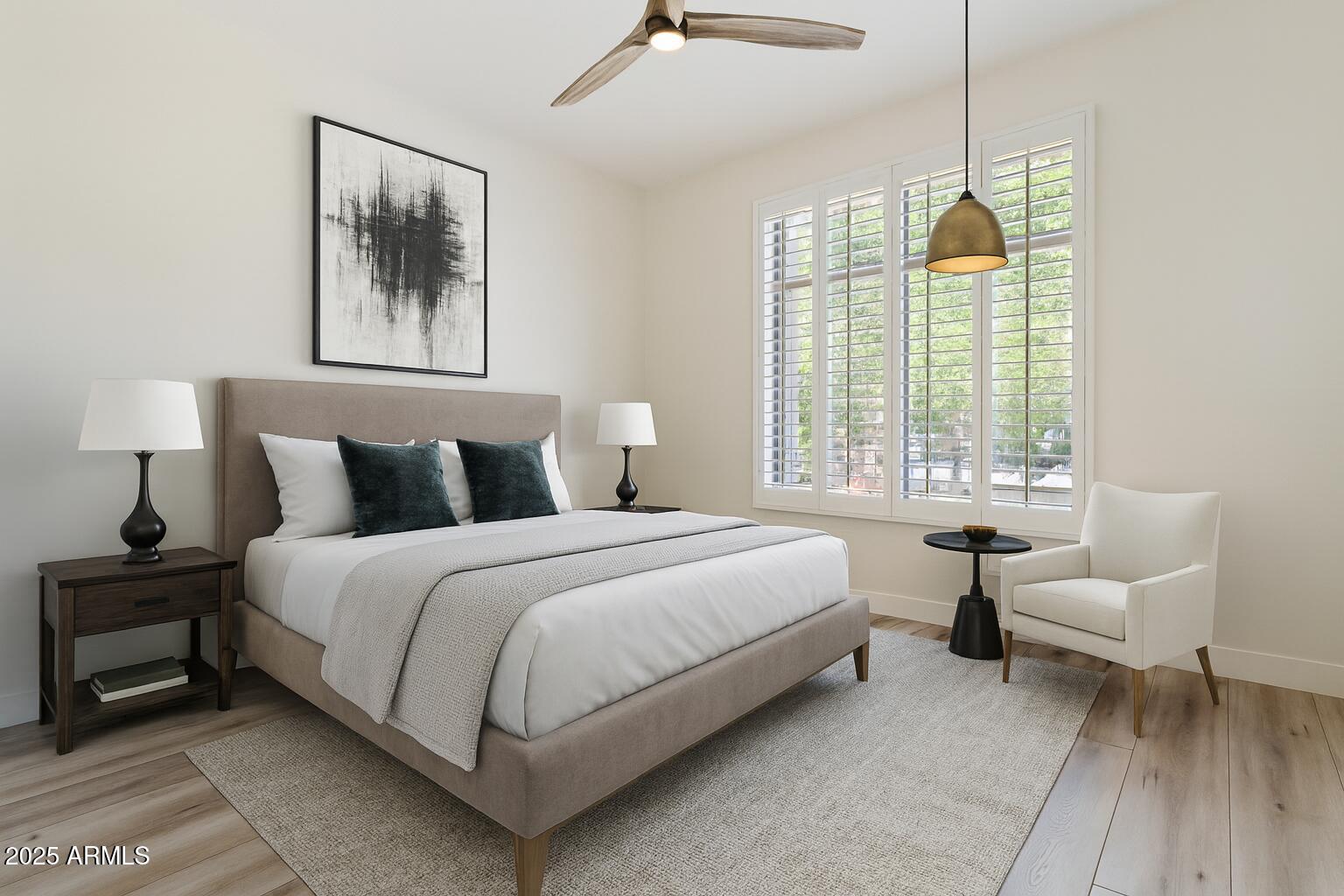 6334 East Viewmont Drive, Unit 9 Mesa, AZ 85215 - Photo 24 of 45 a spacious bedroom with a bed and a large window