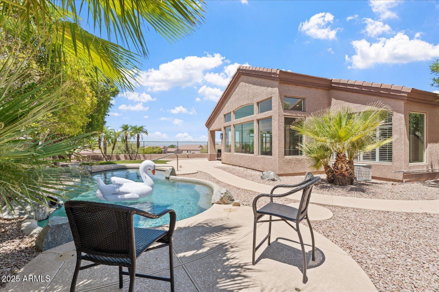 6334 East Viewmont Drive, Unit 9 Mesa, AZ 85215 - Photo 32 of 45 a view of a house with backyard and sitting area